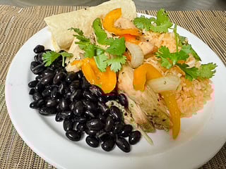 Chicken fajita plate with rice, black beans, and tortilla from the Leisure Vale senior dining menu